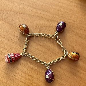 A Faberge egg kind of bracelet. 2 little stones are missing